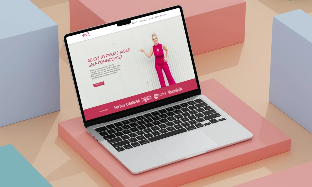 Laptop mockup on a modern pastel background displaying the hero page of a website for Viva Confidence Coach.